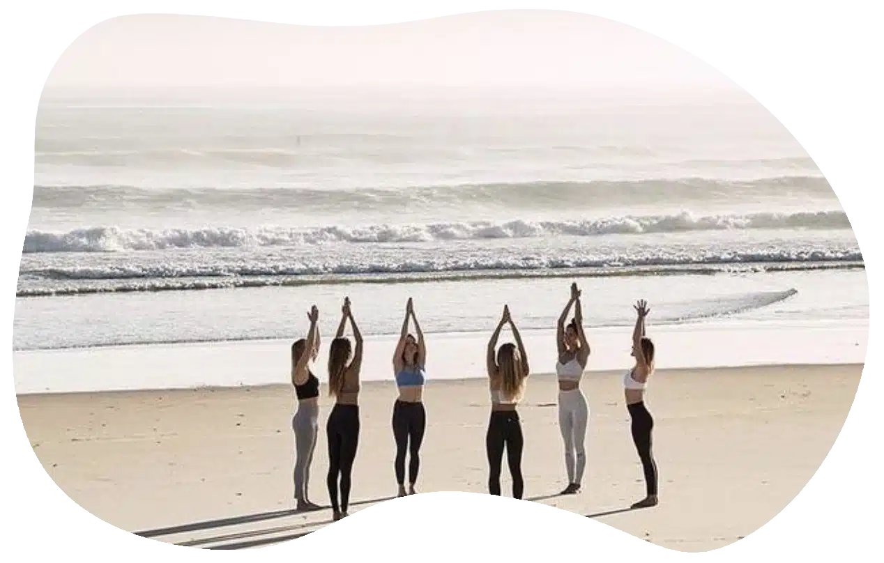 A group of women gathering on the beach
